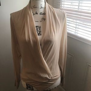 Very classy cream colored  body shirt by BeBe